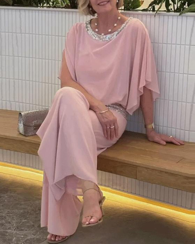 Marcelina | Elegante tweedelige set met pailletten en kleurrijk blokpatroon