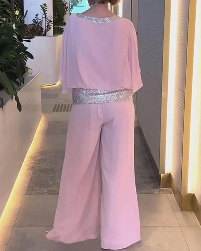 Marcelina | Elegante tweedelige set met pailletten en kleurrijk blokpatroon