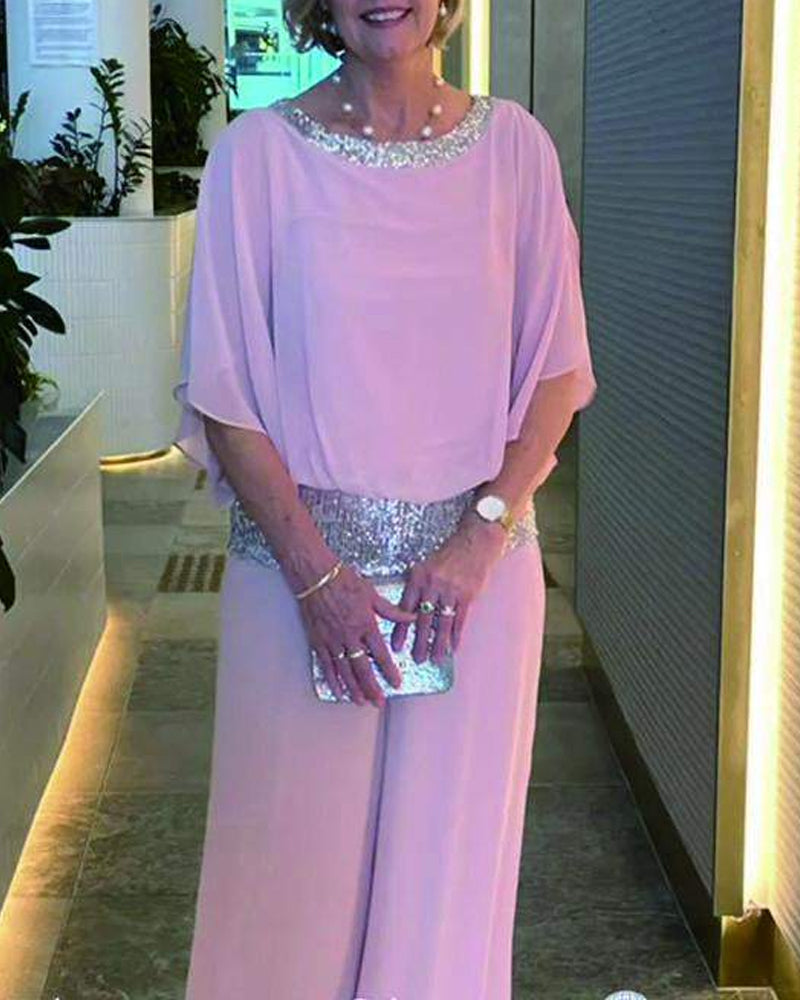 Marcelina | Elegante tweedelige set met pailletten en kleurrijk blokpatroon